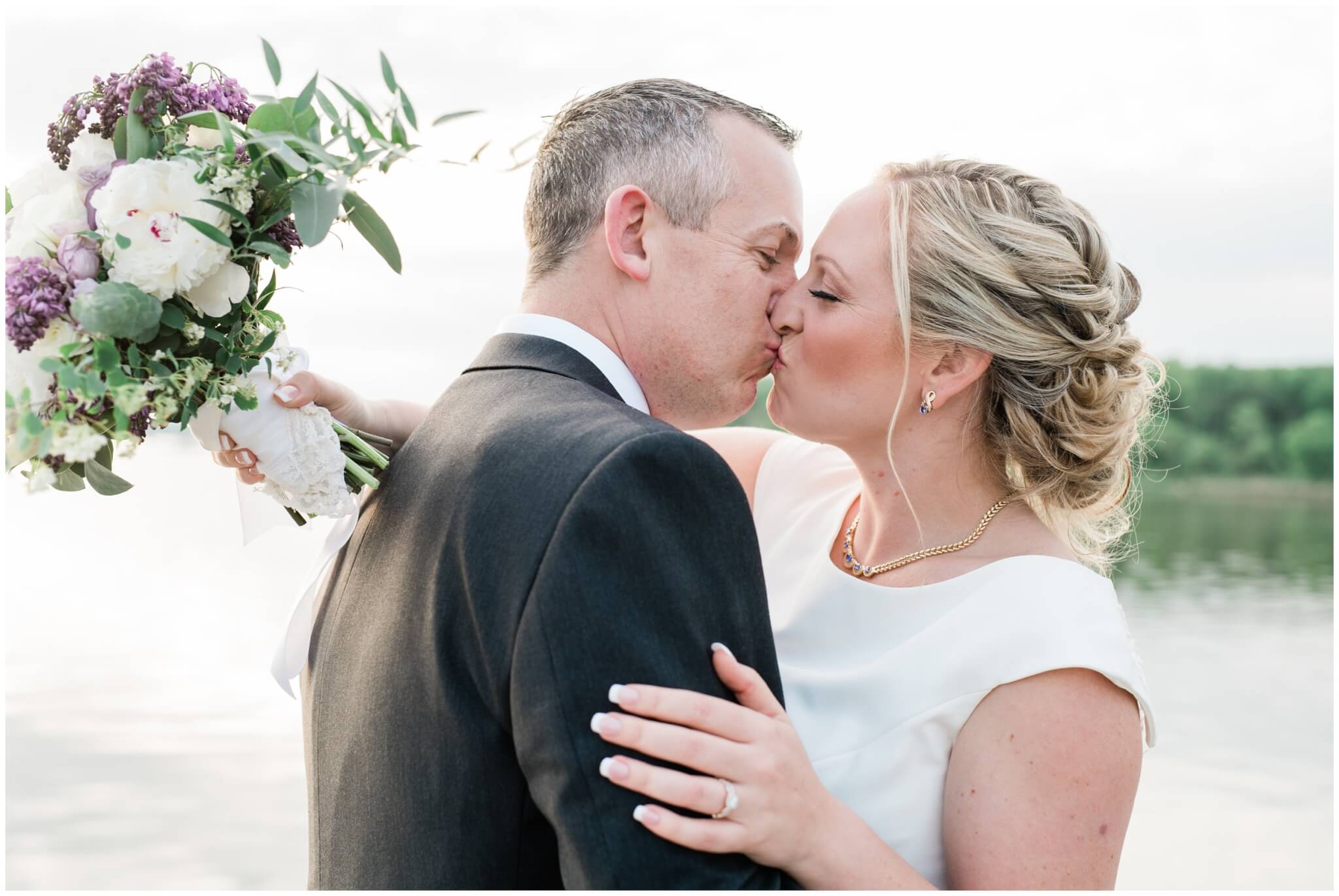 maryland sunset kiss on dock newlyweds
