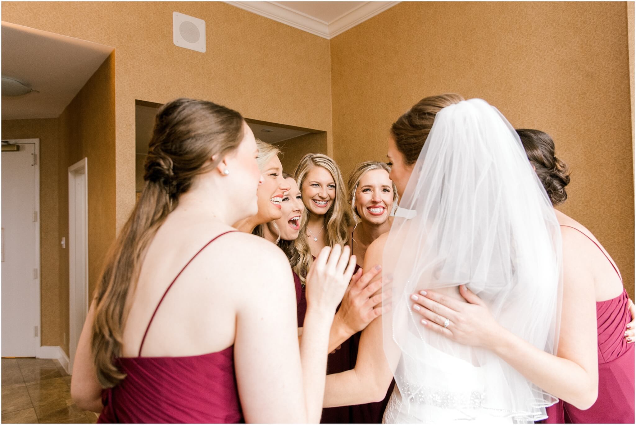 bridesmaids seeing bride for the first time before wedding
