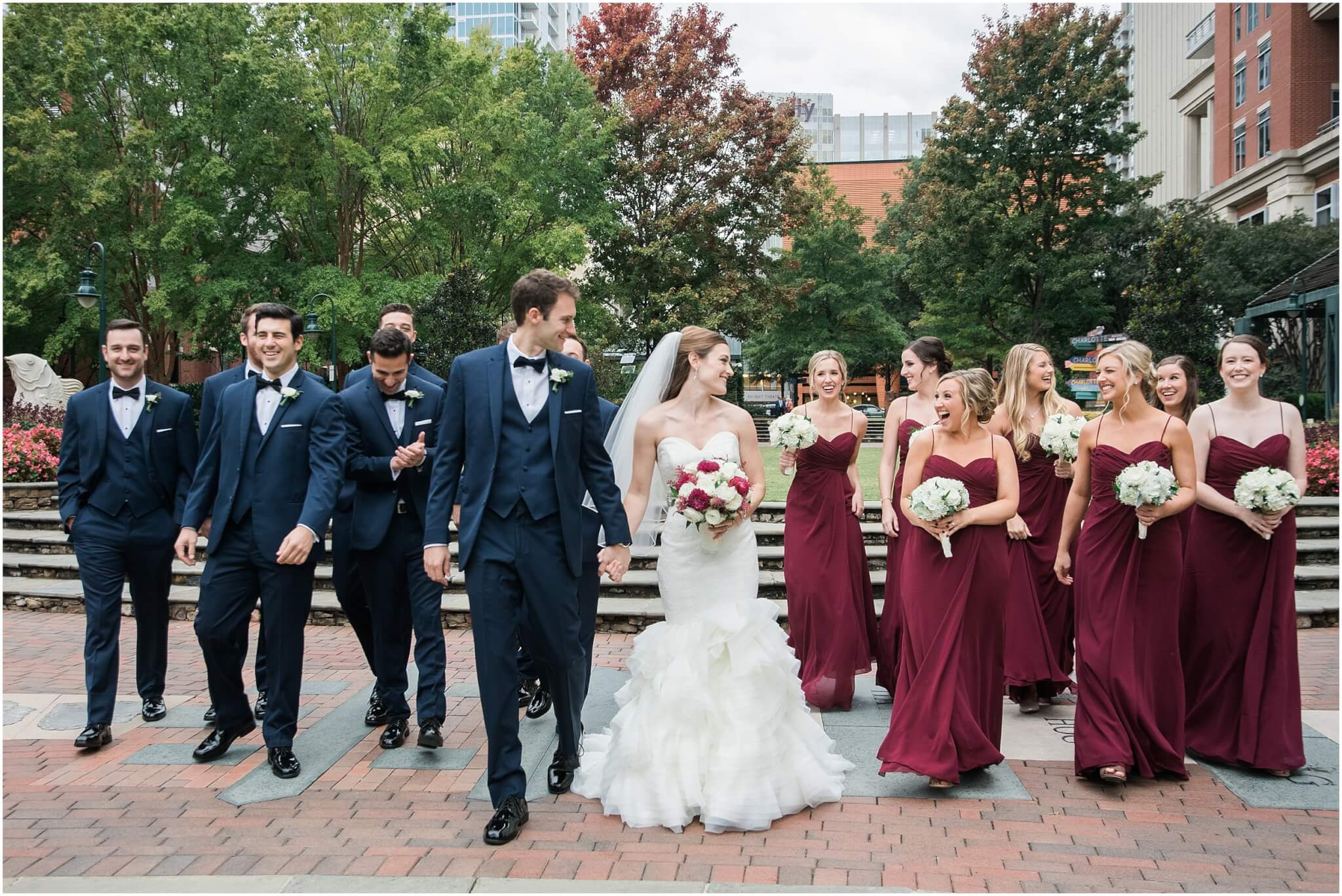 bride and groom walking with bridal party before wedding in charlotte 