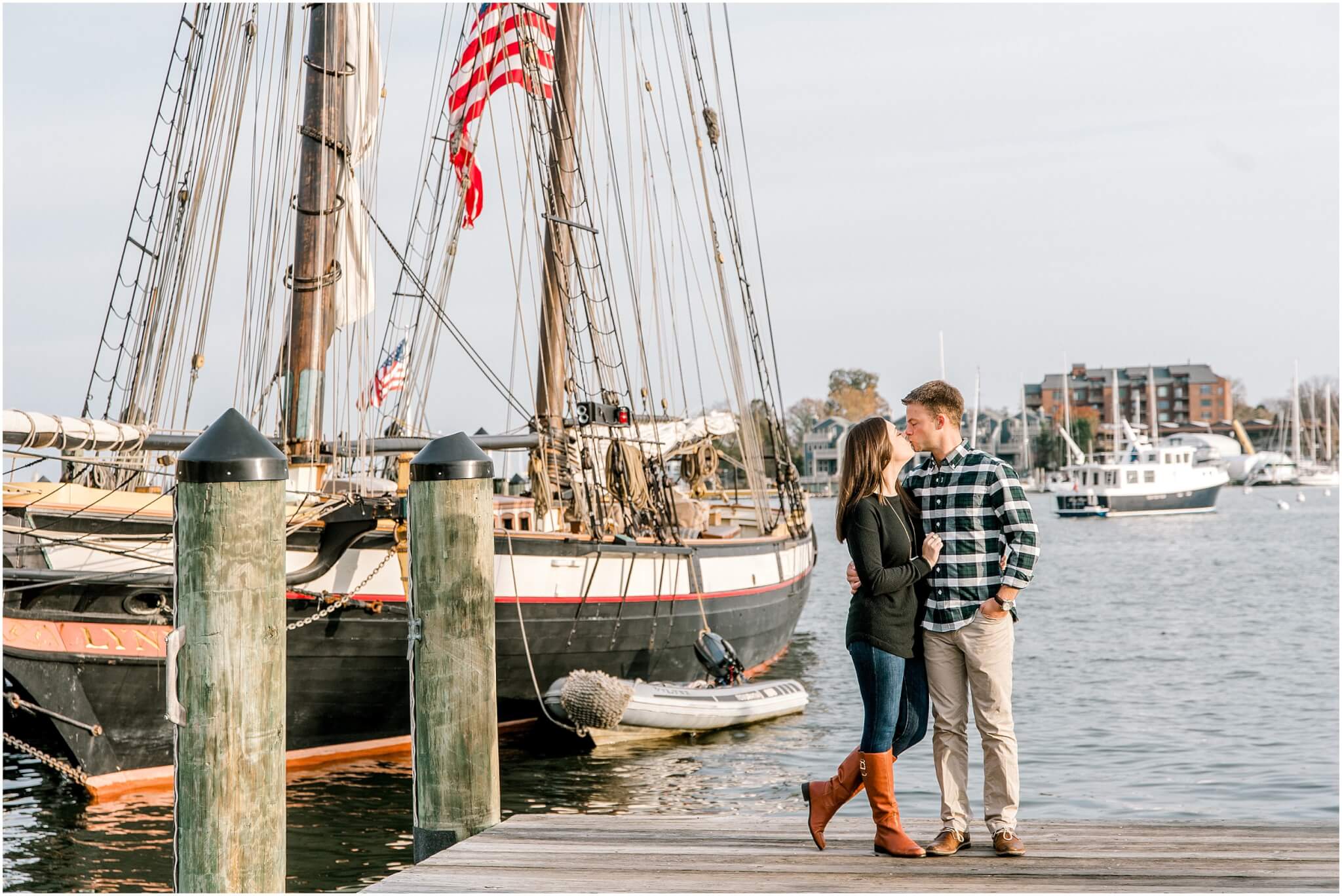 couple standing on the dock for annapolis engagement session 