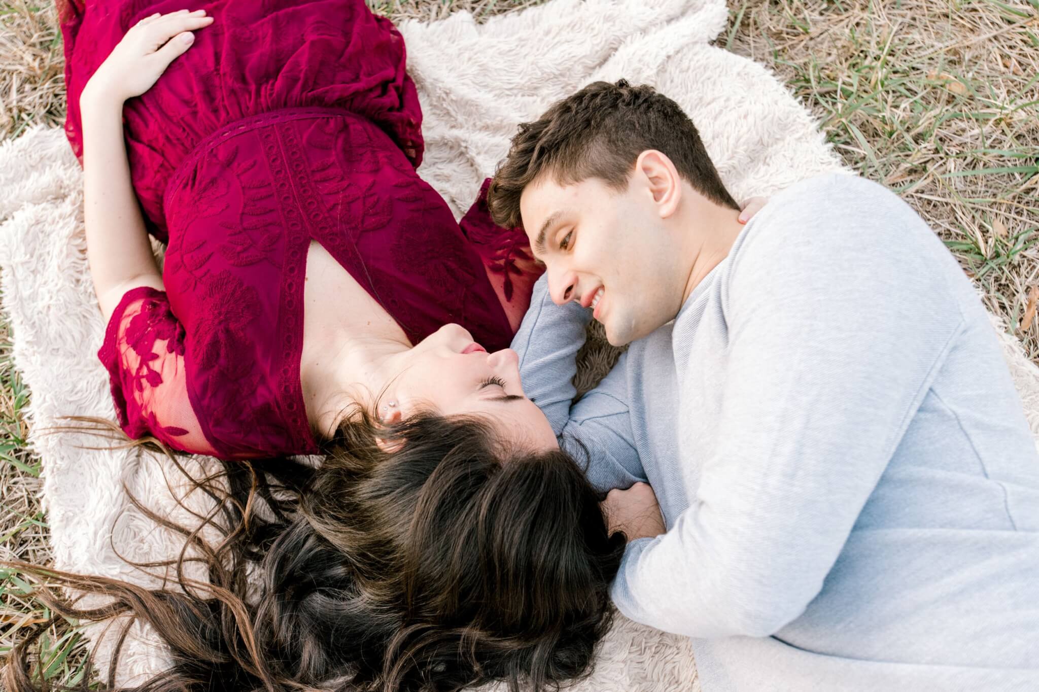 laying on ground for engagement pictures