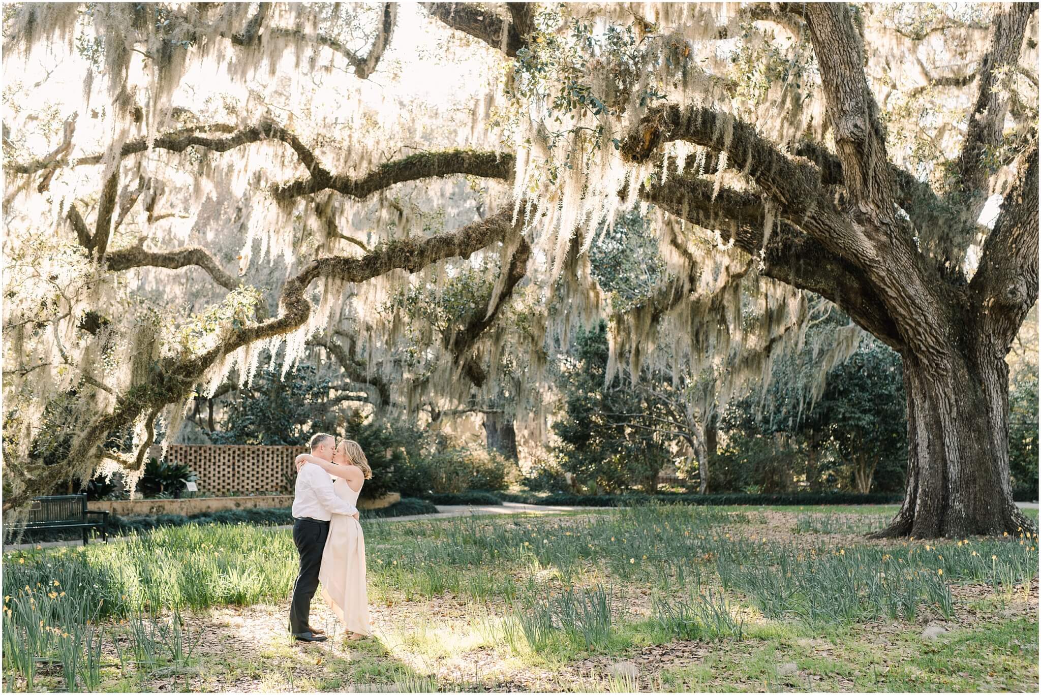 engaged couple kissing under live oak, south carolina wedding photographer
