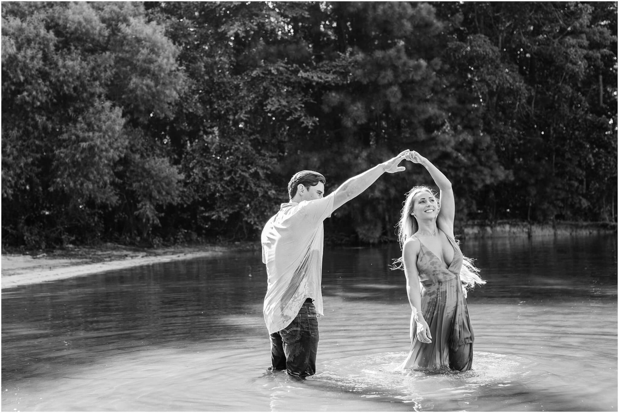 couple dancing in the water, lake norman engagement session