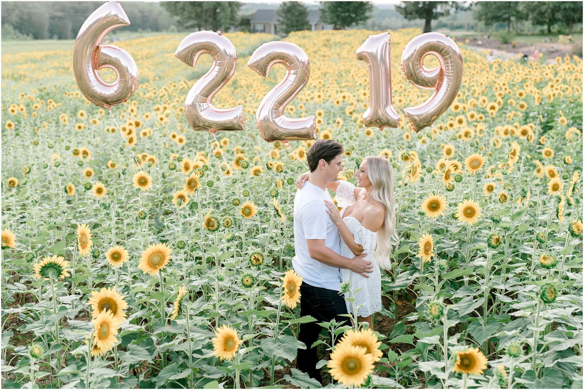 engagement session in sunflower field, charlotte wedding photographer