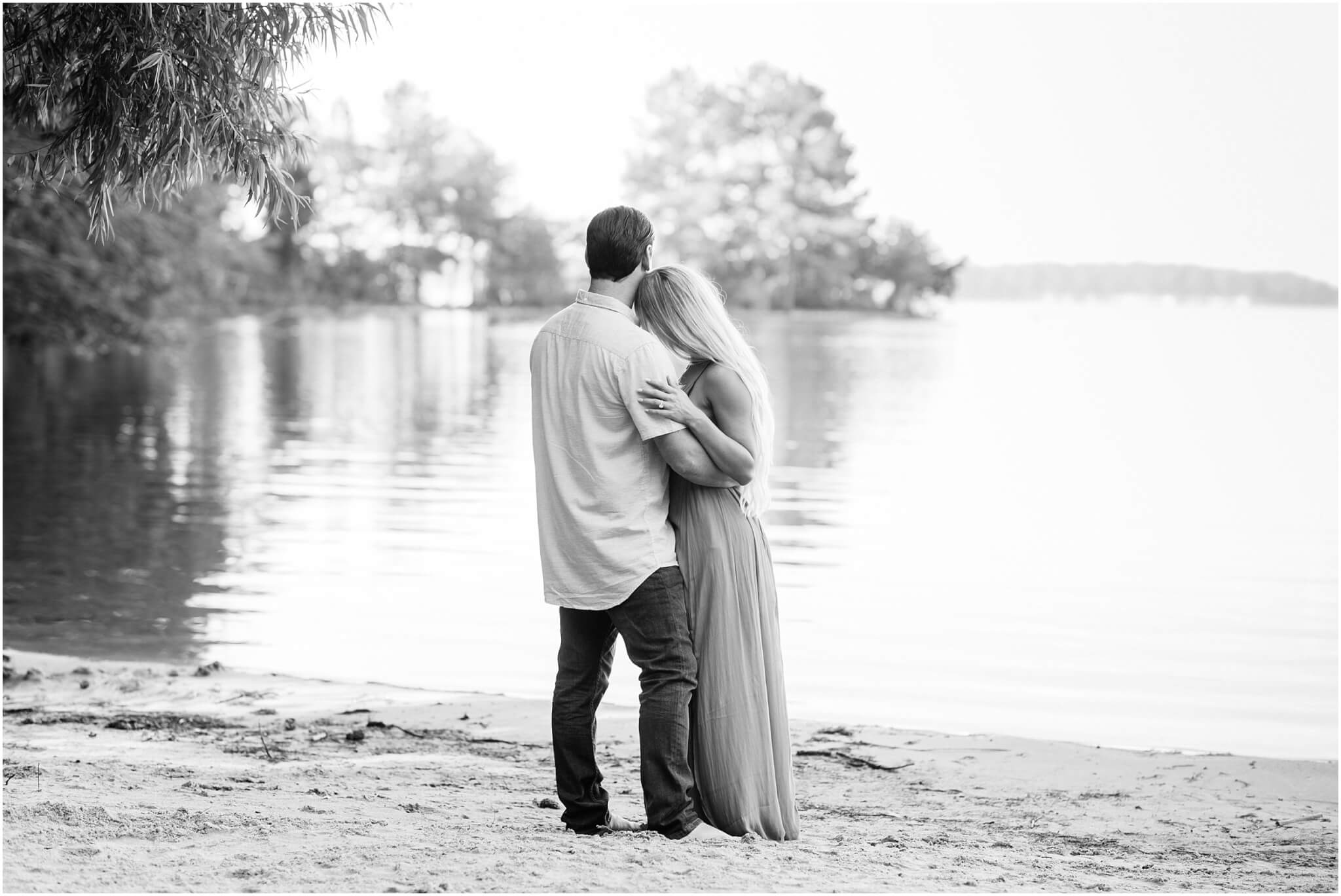 couple looking out at lake norman, charlotte engagement session