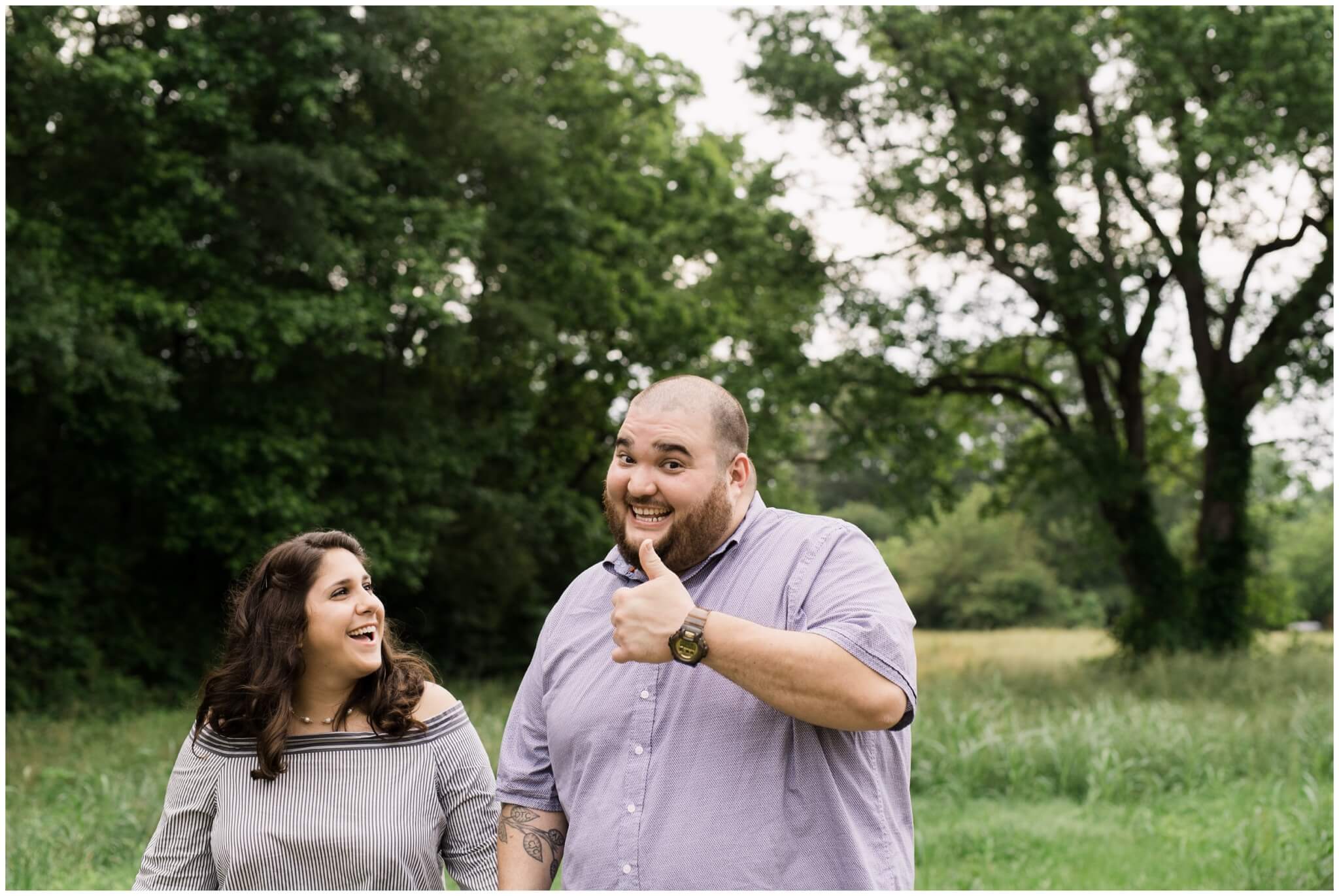 thumbs up from fiance treehouse vineyard engagement photos