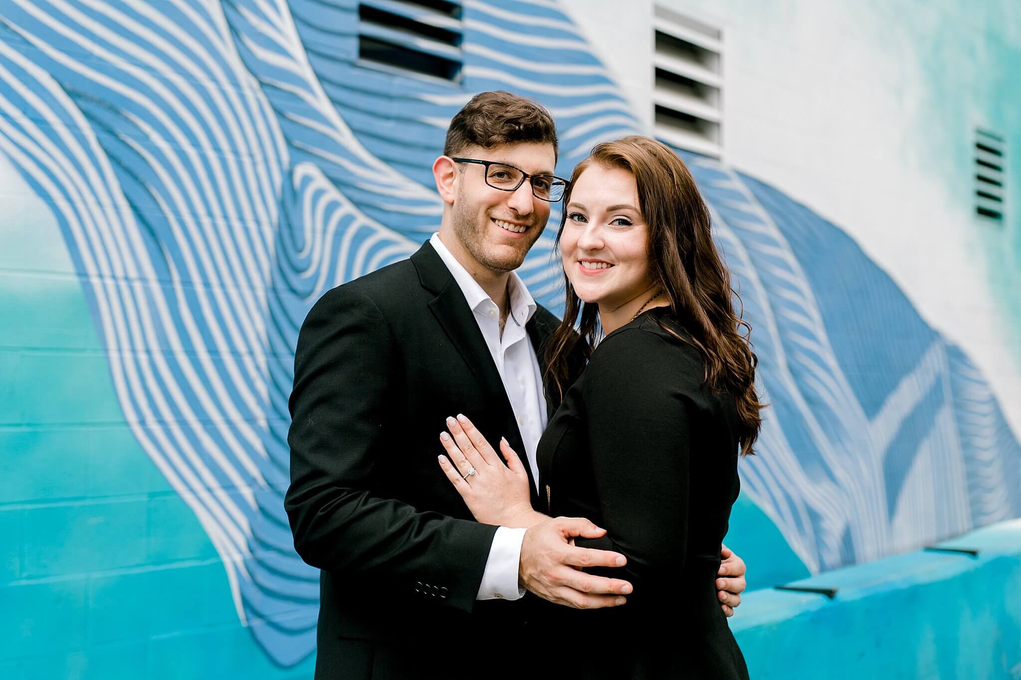 engagement photos in front of charlotte mural
