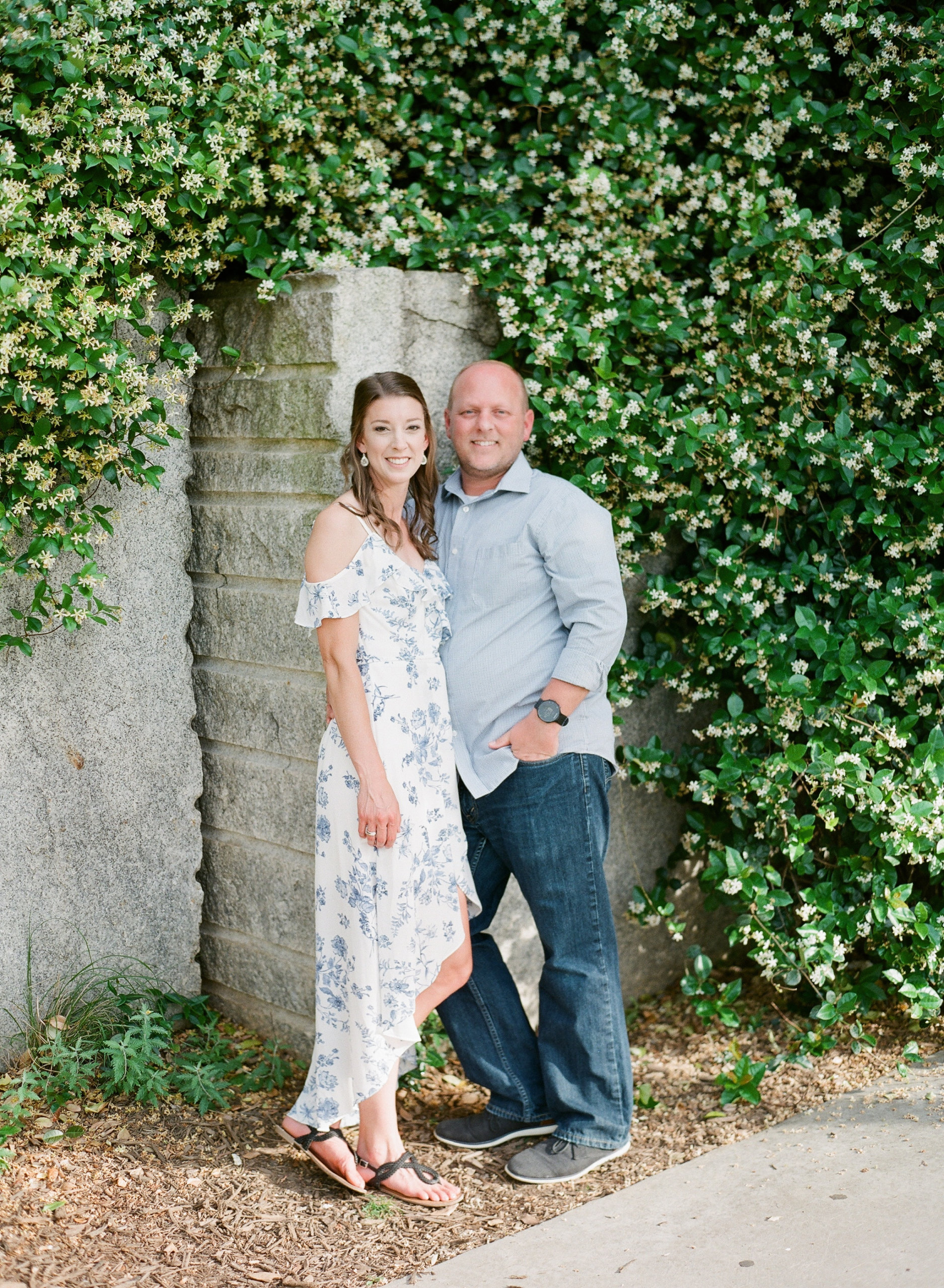 Wedding guests smiling wearing casual button up and flowy boho dress