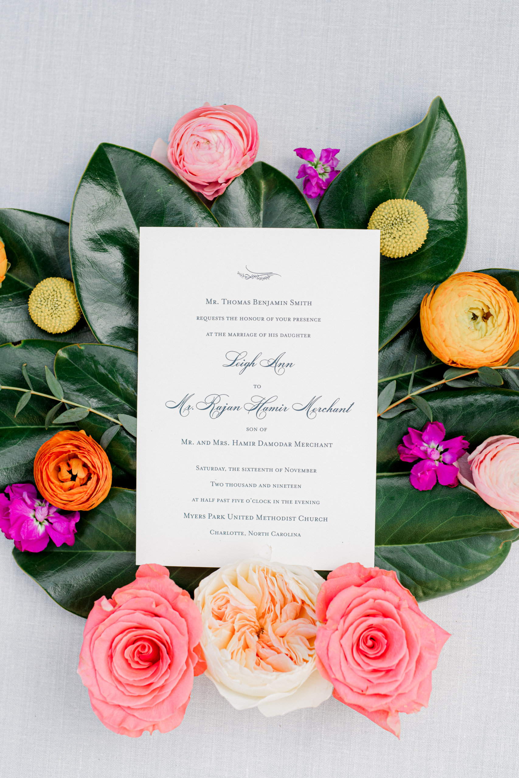 Wedding stationary flat lay on colorful florals