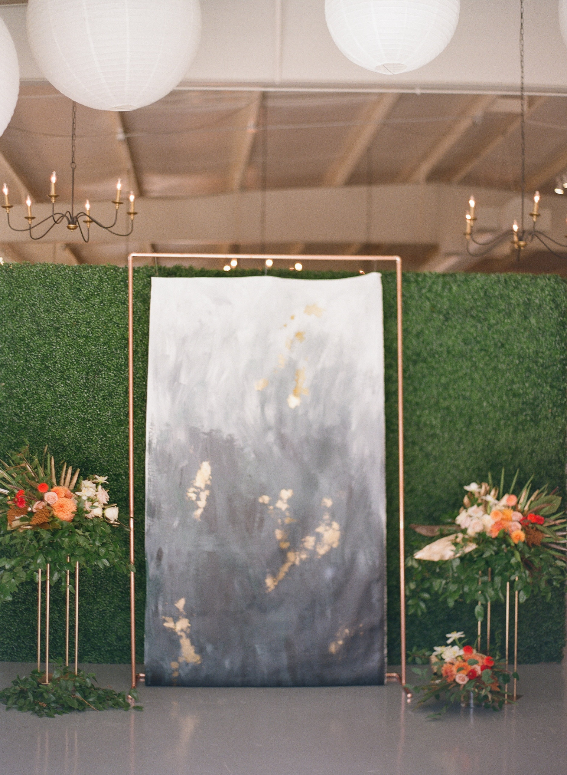 Painted blue and gold ceremony backdrop