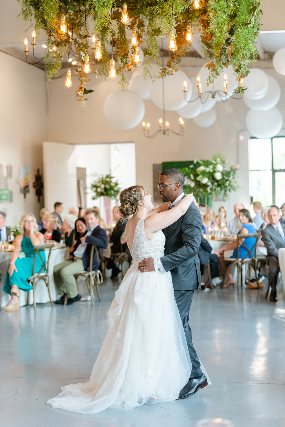Bride and groom at first dance at Collector's Room Venue in Charlotte