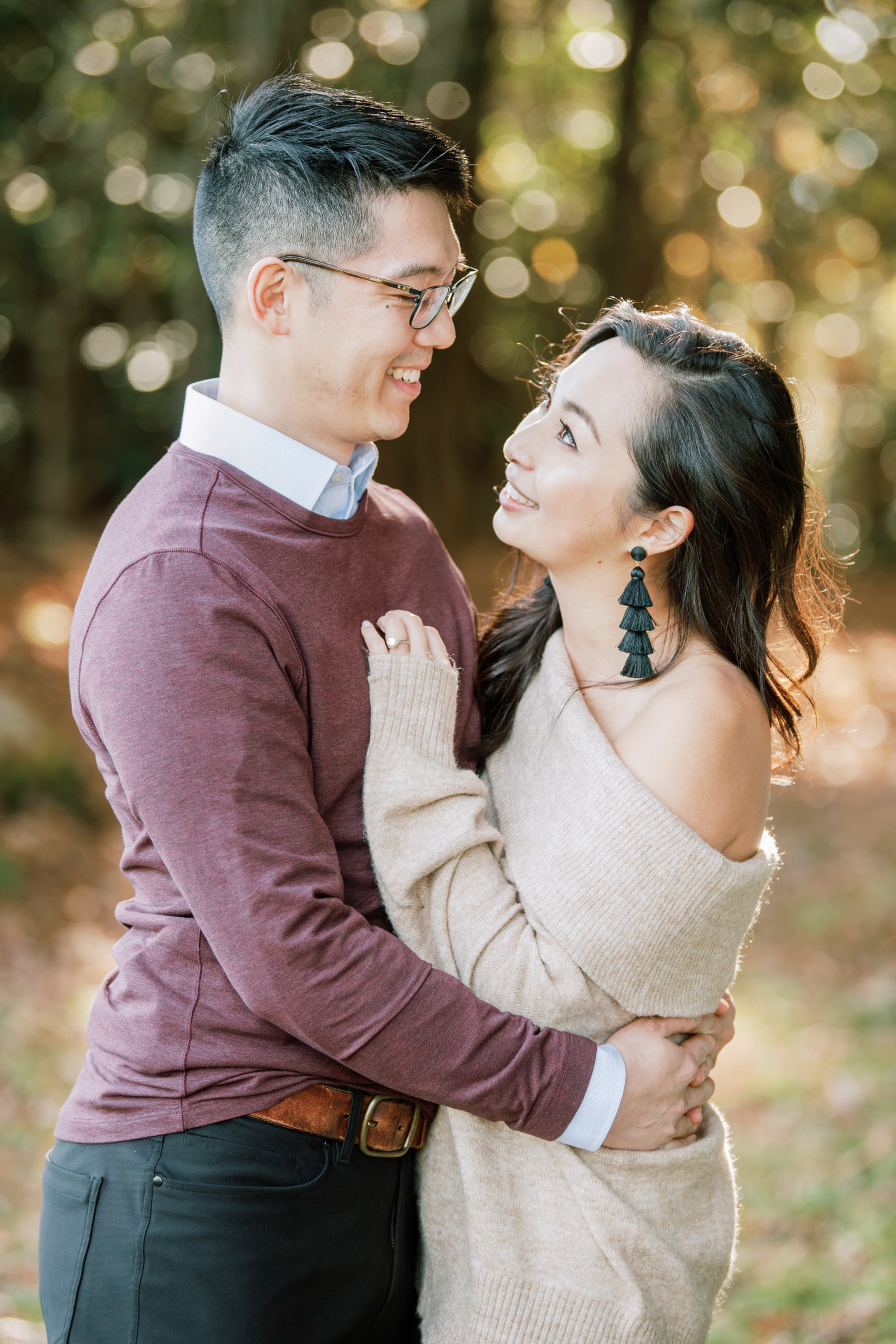 Engaged couple wearing sweaters for fall engagement at Blue Ridge Parkway North Carolina