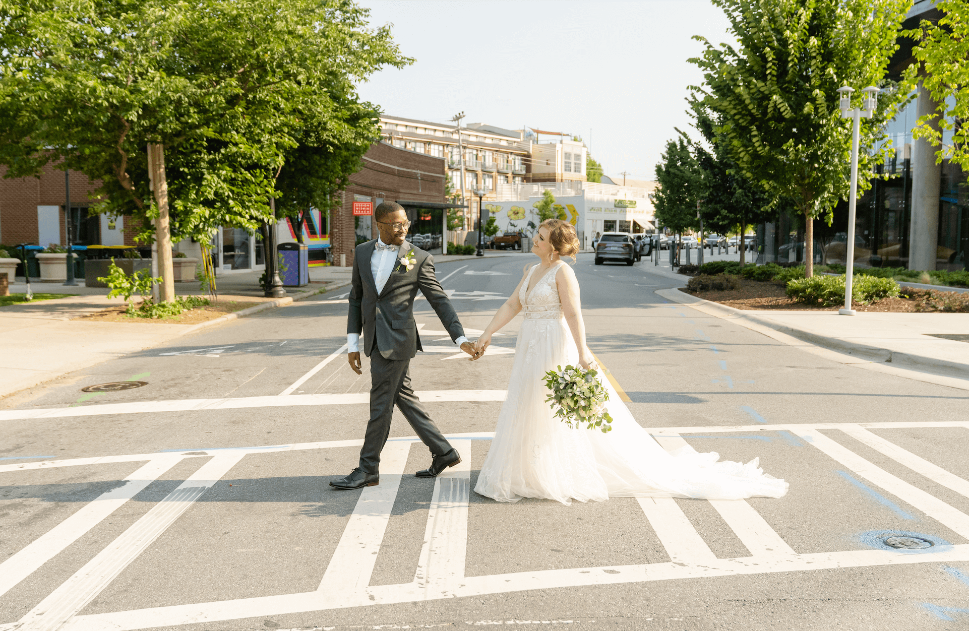 Bride and groom walking in the street of Charlotte