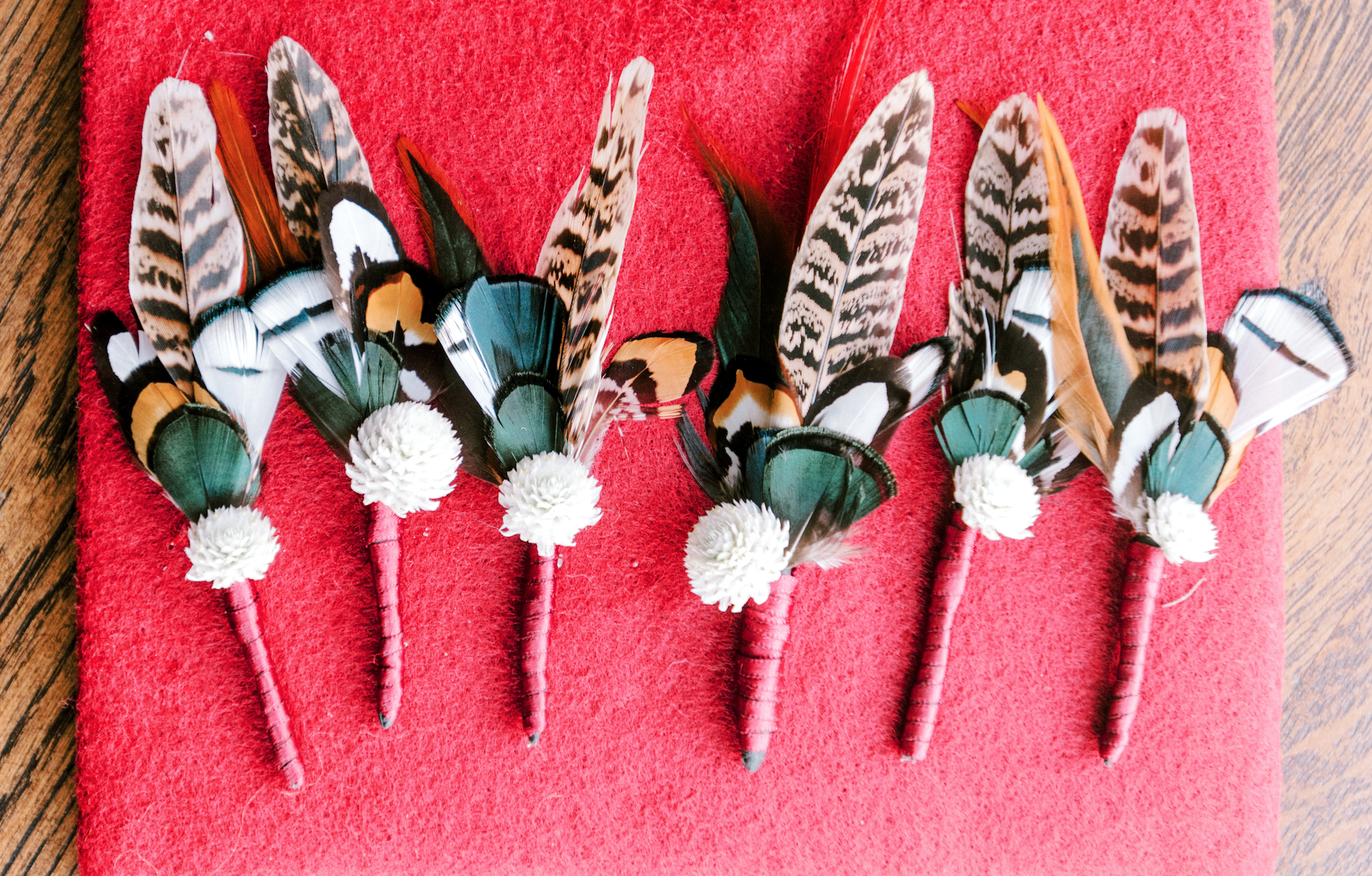 Feather boutonnieres for fall wedding