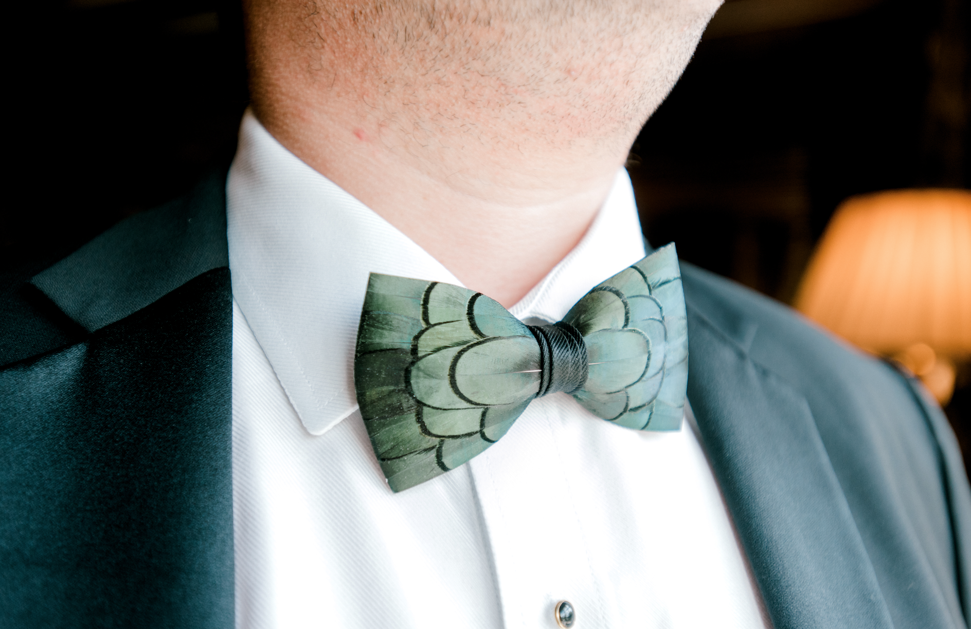 Groom wearing emerald green bowtie for fall wedding