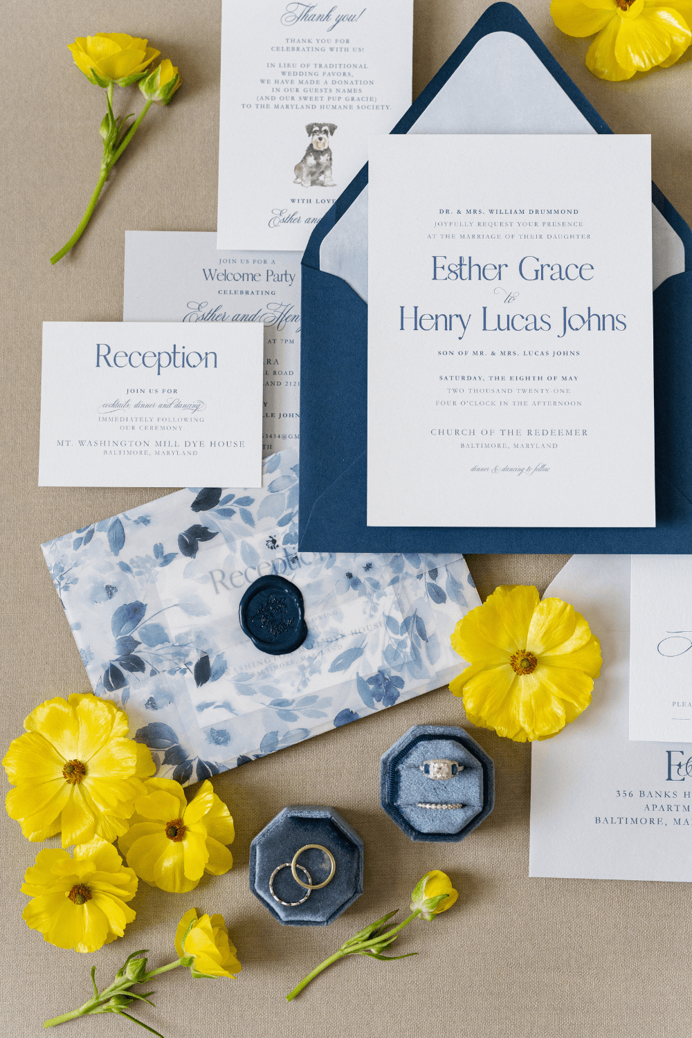 navy and yellow spring wedding stationery flat lay photography