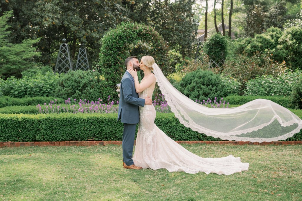 Bride and groom kissing at Duke Mansion wedding