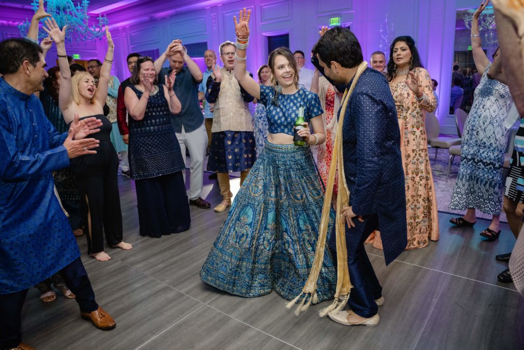 Bride and groom dancing at Indian wedding Sangeet